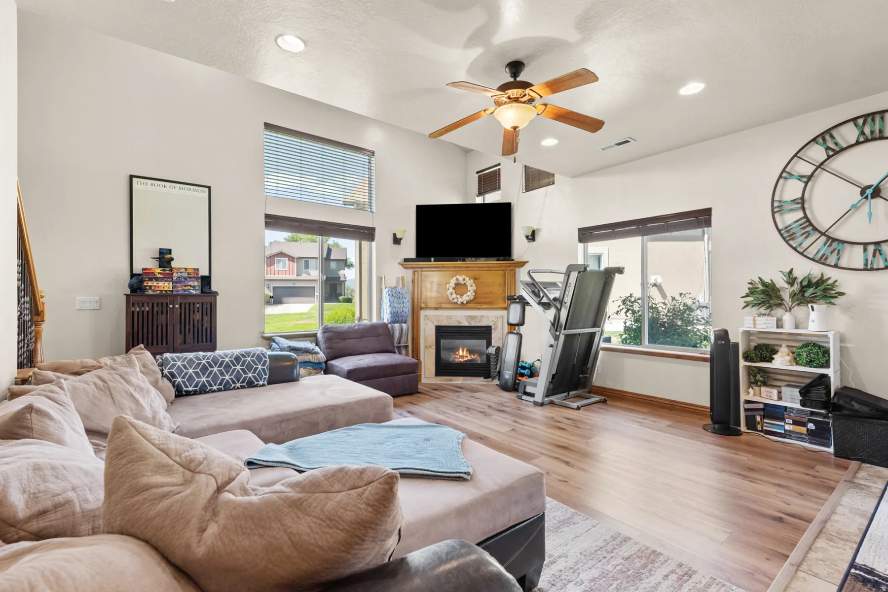 Bright living room with fireplace and high ceilings